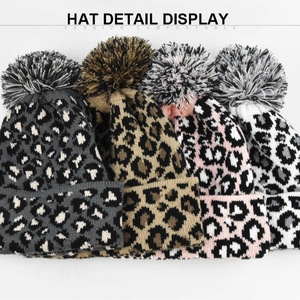 Women's warm winter leopard print knit beanies with fluffy faux fur pom poms in four colors