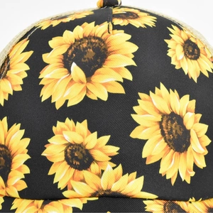 Black cotton ponytail baseball cap featuring bright sunflower prints and mesh panels