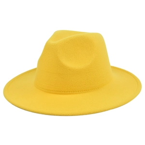 Detailed macro view of vibrant yellow wool fedora hat with wide brim and smooth texture