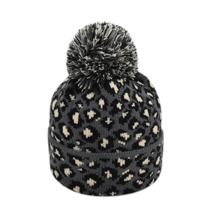 Winter leopard print knit beanie for women with a fluffy faux fur pompom decoration