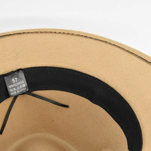 Detail view of khaki wool fedora hat interior with adjustable strap and size label