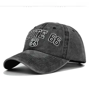 Detail of Route 66 white embroidery on vintage washed dark grey cotton baseball cap