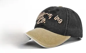 Close-up of Boston Escaping Co. 3D embroidery on washed vintage colorblock baseball cap
