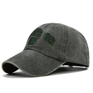 Detailed embroidery of Route 66 logo on washed vintage grey cotton baseball cap