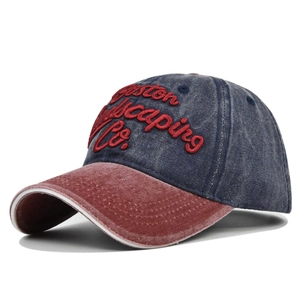 Detail of Boston embroidery on washed denim baseball cap with contrast brim and white piping
