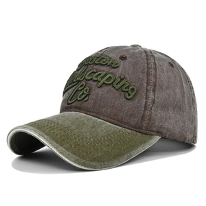Detail of Boston Landscaping Co. 3D embroidery on washed vintage cotton baseball cap