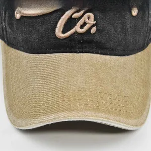 Detailed close-up of 3D embroidery on washed cotton baseball cap with vintage stitching