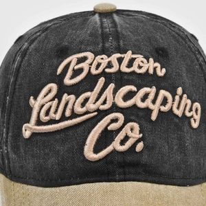Detail of Boston Landscaping Co. embroidery on a washed vintage baseball cap
