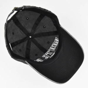 Detailed inner view of washed cotton baseball cap with adjustable metal buckle and stitching