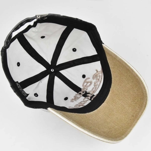 Detail view of cotton baseball cap interior with wash label and contrast brim stitching
