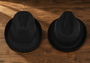Classic black wool fedora hat with wide brim showing top and side view perspectives