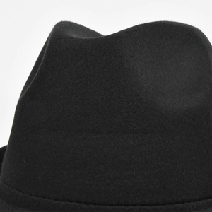 Detailed close-up showing the soft wool felt texture and crown stitching of this black fedora