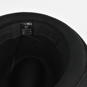 Detail of black wool fedora interior showing 100% polyester label and size 57 tag