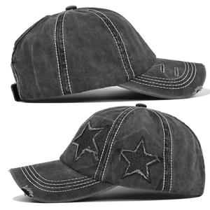 Close-up of washed dark grey baseball cap with star patches and worn-out brim details