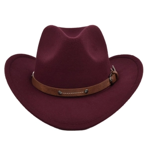 Detail of burgundy felt cowboy hat with leather strap, metal buckle and silver rivets