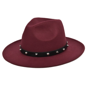 Detail of burgundy wool fedora hat featuring black leather band and silver metal studs