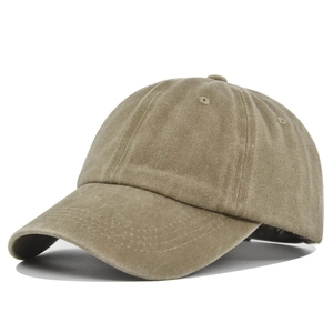 Detail view of khaki washed cotton baseball cap fabric texture and reinforced stitching