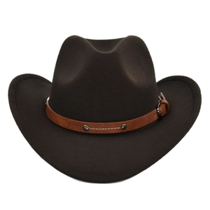 Detail of dark brown felt cowboy hat with leather band and metallic silver studs