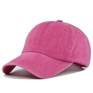 Detail view of fuchsia washed cotton baseball cap with vintage distressed texture
