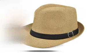 Detail of light brown woven fedora hat featuring a black band with a silver buckle