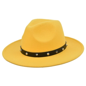 Detail of bright yellow wool jazz hat featuring black leather band with silver metal studs