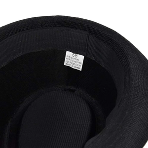 Macro detail of hat interior showing size 58 label and cotton polyester blend fabric