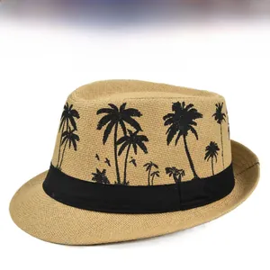 Detail of khaki straw fedora hat with black ribbon and tropical palm tree print