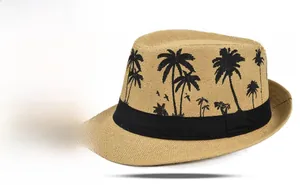 Detailed close-up of straw jazz hat with black coconut tree print and decorative ribbon
