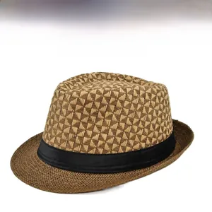 Detail of woven straw fedora hat with brown geometric texture and black ribbon band