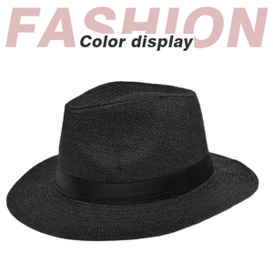 Close-up of black straw fedora hat featuring woven texture and satin ribbon band