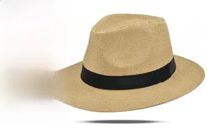 Detailed close-up of wide-brimmed Panama straw hat featuring a black grosgrain ribbon band