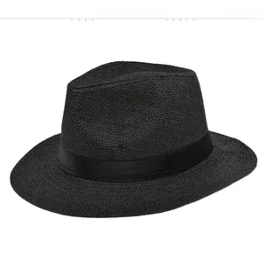 Close-up of black wide-brim Panama straw hat featuring a tonal satin ribbon band
