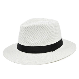 Detail of white woven straw Panama hat featuring a classic black decorative ribbon band