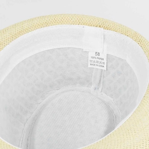 Detail of 100% paper fiber sun hat featuring white sweatband and size label inside