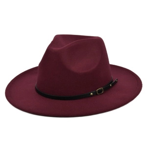 Detail of wide brim burgundy wool fedora hat featuring black leather band and metal rivets