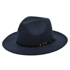 Detail of dark blue fedora hat featuring black leather band and gold metal rivet buckle