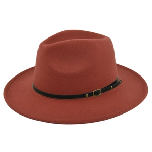 Detail of terracotta wool fedora with black leather band and gold metal rivet accents