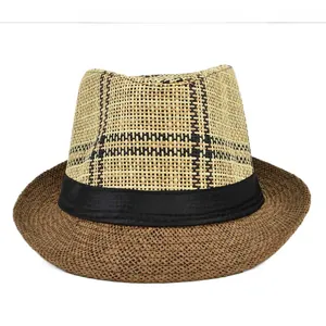 Detailed close-up of woven straw fedora hat featuring classic brown brim and plaid crown