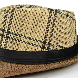 Close-up of classic straw fedora with light brown and black checkered weave and black band