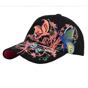 Detail of colorful butterfly and floral embroidery on a black cotton baseball cap