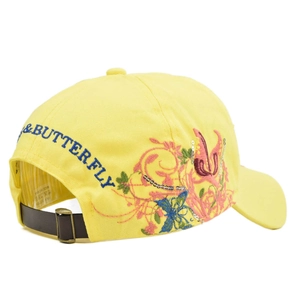 Detail of yellow cotton baseball cap with butterfly embroidery and sequin accents