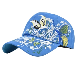 Detailed view of butterfly and floral embroidery with sequins on a blue baseball cap