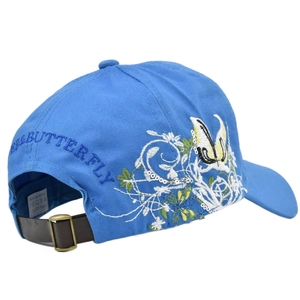 Detail of blue baseball cap featuring butterfly embroidery and adjustable leather strap