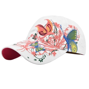 Detail of white baseball cap showing colorful butterfly embroidery and silver sequins