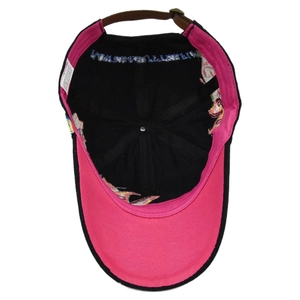 Detail of cotton baseball cap interior with sequin embroidery and adjustable leather strap