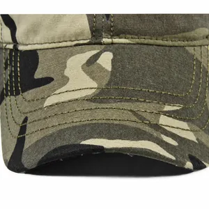 Close-up of camouflage baseball cap brim with reinforced parallel stitching and canvas texture