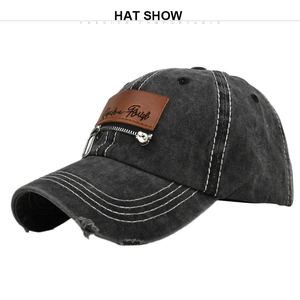 Detail shot of distressed denim baseball cap with leather patch and silver zipper detail