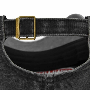 Detail of the vintage washed black baseball cap with adjustable antique bronze metal buckle