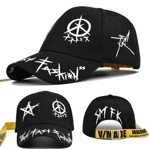 Close-up of black graffiti baseball cap featuring long yellow industrial brand straps