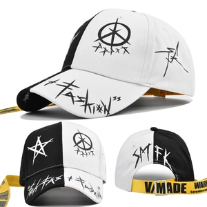 Detail of street style baseball cap with star graffiti and long yellow adjustable strap